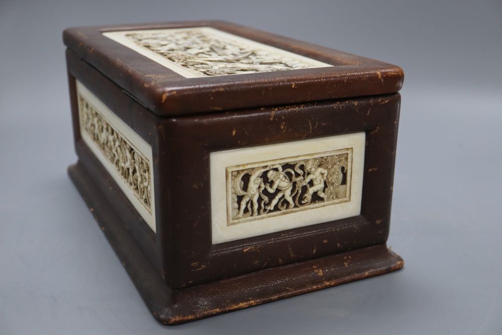 A neo-classical style ivory mounted leather casket, length 31cm